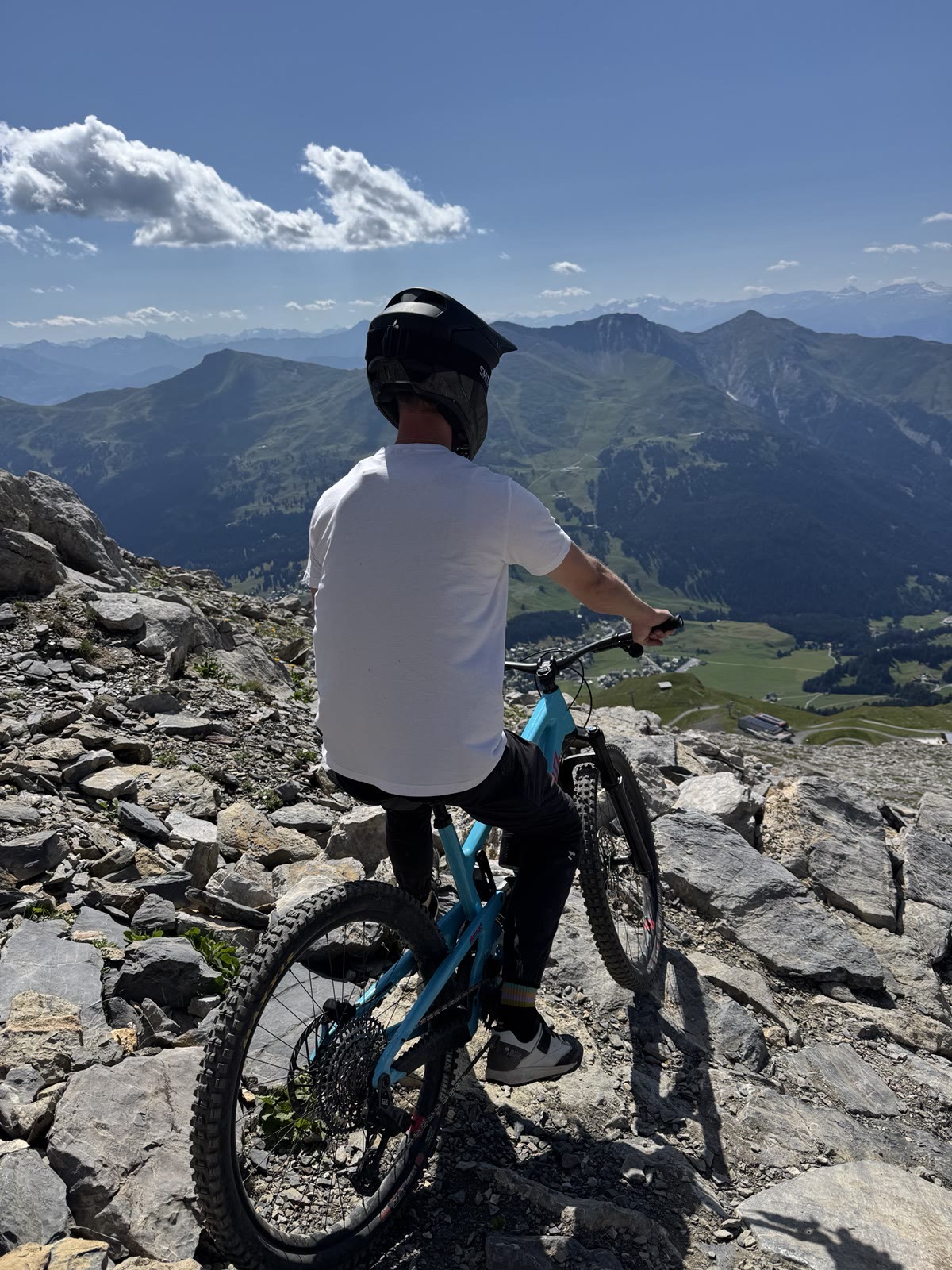 Gellert overlooking the Lenzerheide mountains with his mountain bike